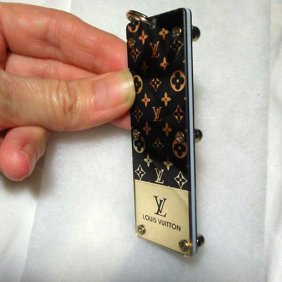 COPY - LOUIS VUITTON KEY FOB / JUST REMOVED PLASTIC LIKE NEW UNUSED GOLD/ BLACK… - Picture 1 of 13